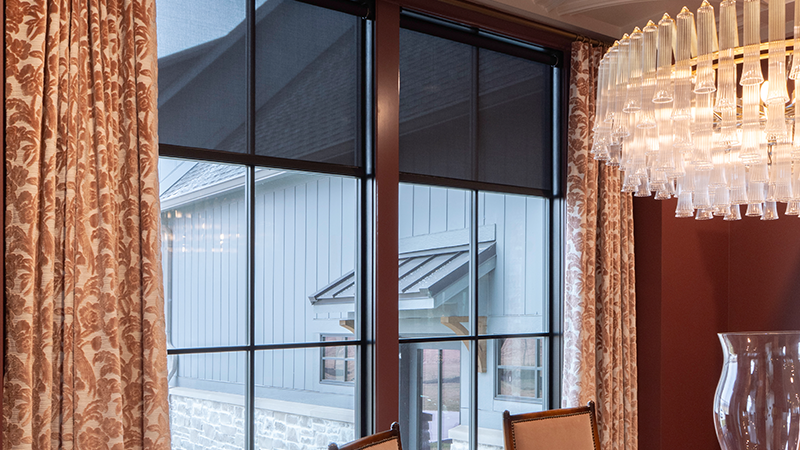 Draper at Home window shades featured in an extravagant dining room