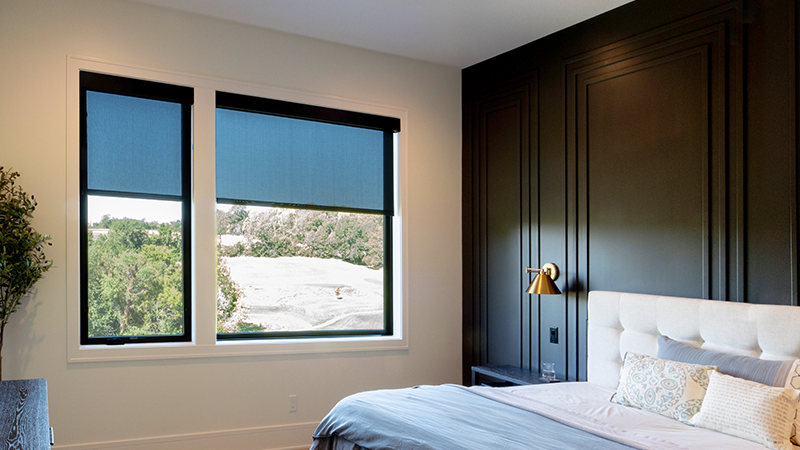 Draper at Home window shades featured in a well-appointed bedroom