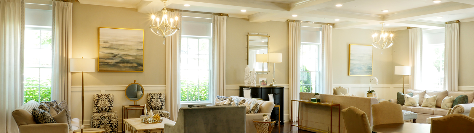 Draper at Home window shades featured in a two-story entry way